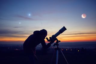 Person with telescope looking at moon and planets in night sky