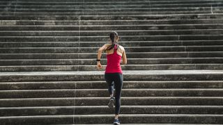 Woman running up stairs