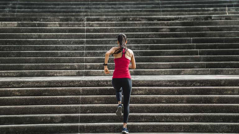 6 mistakes every makes with Strava: Pictured here, a fit woman running up stairs