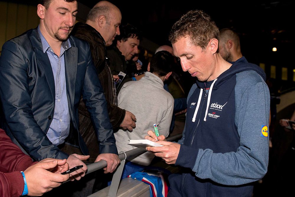 Dan Martin signs an autograph at the Etixx-QuickStep team presentation.