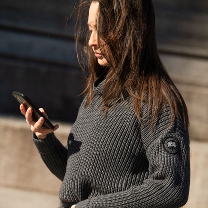 Jeans, Clothing, Beauty, Outerwear, Denim, Sweater, Arm, Technology, Long hair, Sleeve, 