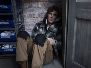 Theo Silverton slumped on the floor in the garage