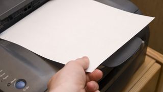 Want a more sustainable printer? image shows paper in printer