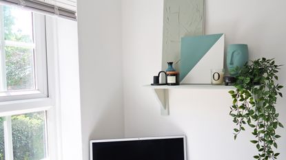 a shelf with brackets in a home office