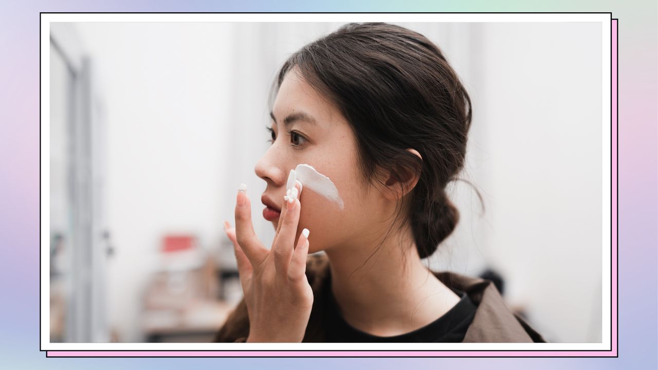 woman applying sunscreen 