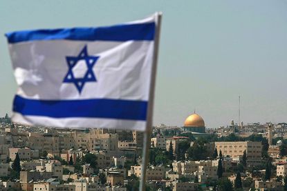 An Israeli flag flies in Jerusalem