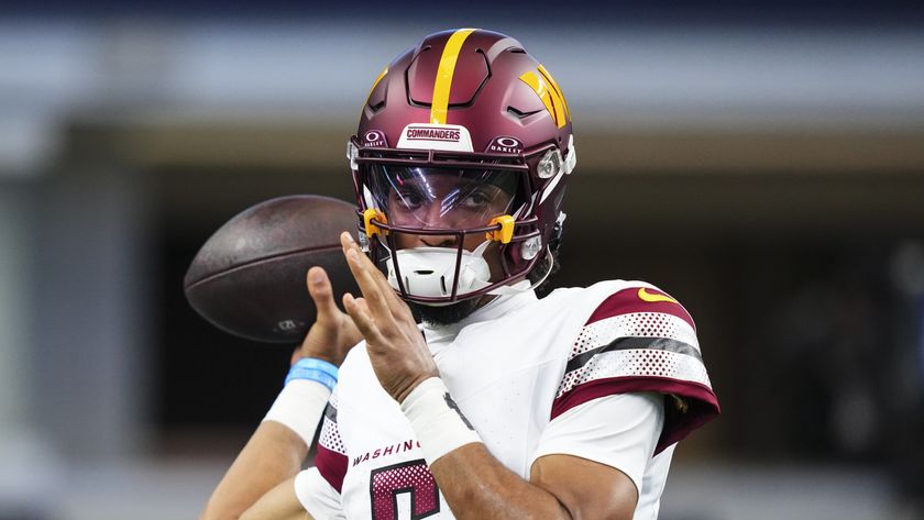 Jayden Daniels #5 of the Washington Commanders warms up prior to an NFL football game against the Dallas Cowboys at AT&amp;T Stadium on January 5, 2025 in Arlington, Texas, ahead of Commanders vs Buccaneers