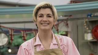 The Great Celebrity Bake Off for Stand Up To Cancer Jodie Whittaker in a pink shirt in the Bake Off tent