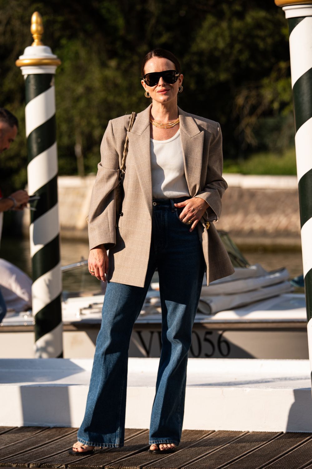 Claire Foy wearing jeans and a blazer