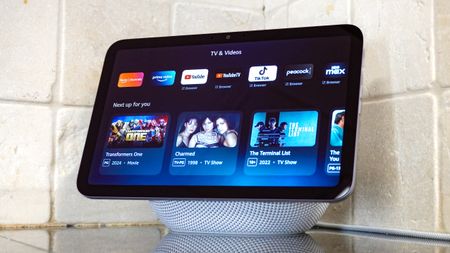 The Echo Show 8 (4th Gen) on a kitchen counter with the TV & Videos menu open