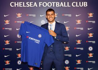 Alvaro Morata poses with a Chelsea shirt after signing for the Blues in 2017.