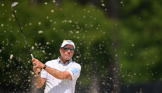 Phil Mickelson hits a bunker shot