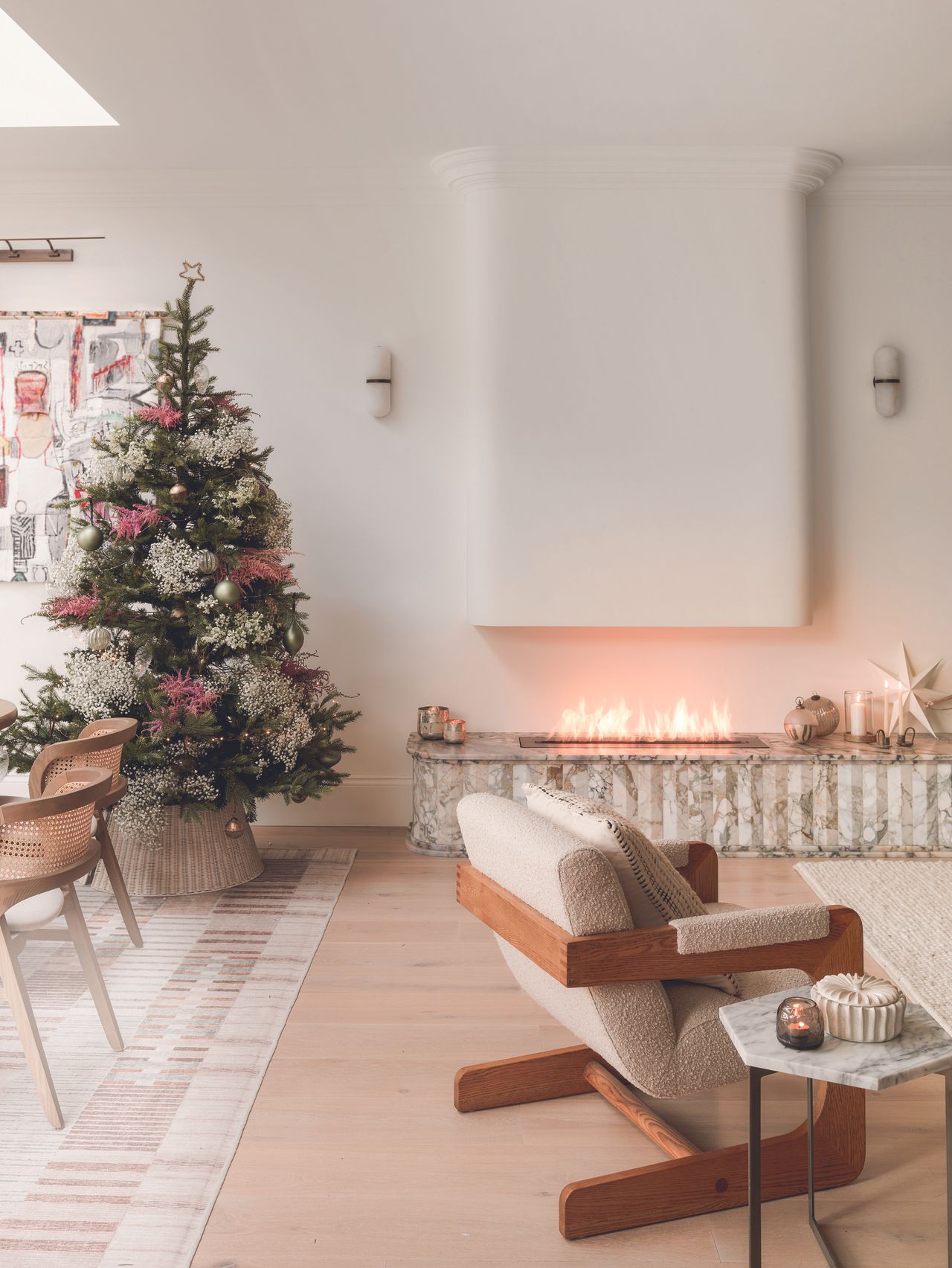 The living room with a modern fireplace and Christmas tree