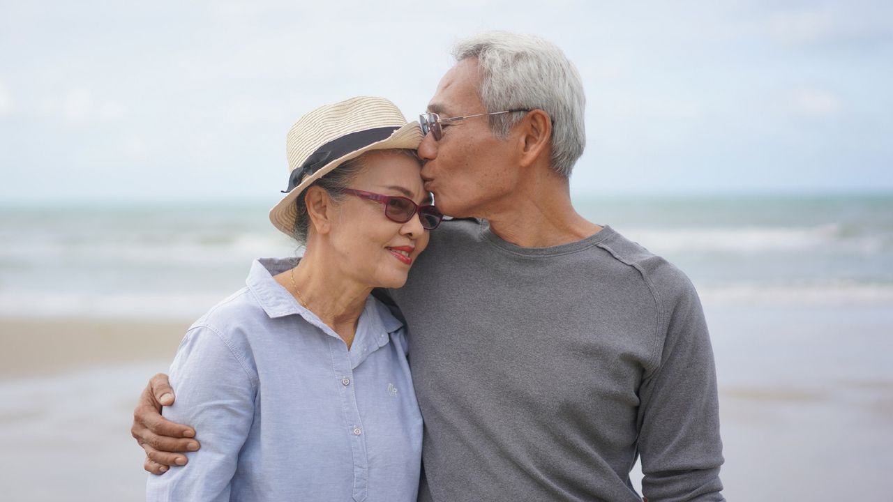 A senior couple on the beach.