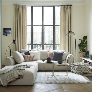 L-shape cream sofa in neutral living room