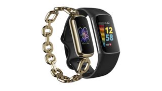 Fitbit Luxe in gold special edition next to Fitbit Charge 5 in graphite black with stainless steel edge