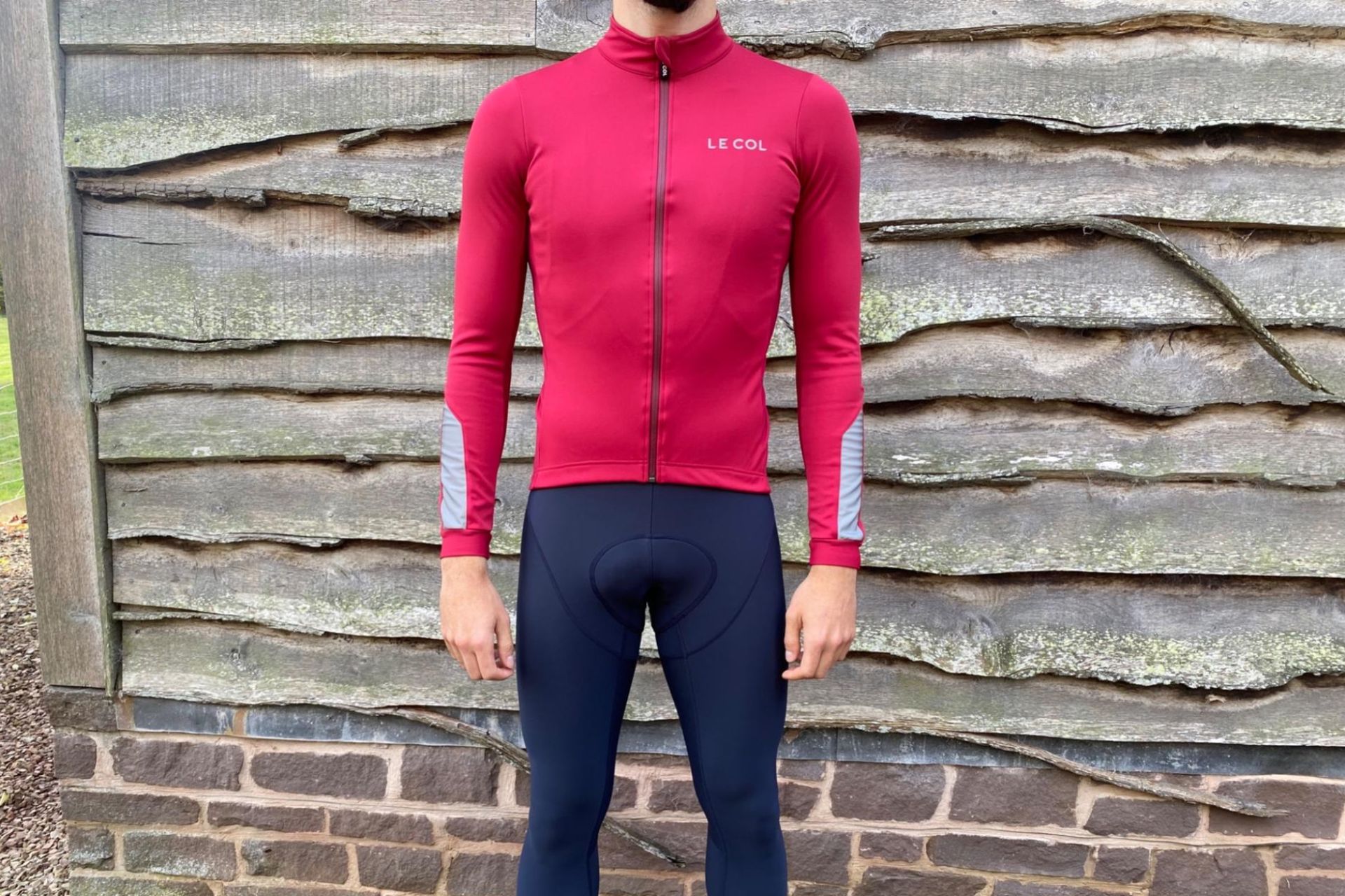 Image shows a rider wearing the Le Col Pro Jacket II which is one of the best winter cycling jackets