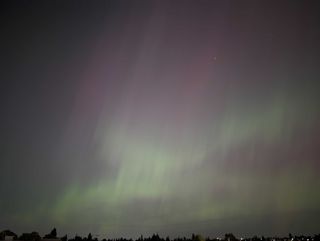 A photo of the northern lights in the night sky