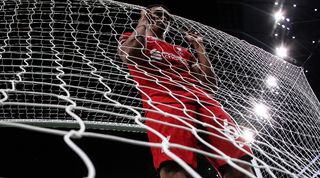 Trent Aleexander-Arnold looks dejected as he holds the back of the net after Tottenham's late winner against Liverpool in September 2023.