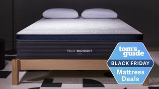 A Helix Midnight Luxe mattress atop a wooden bedframe with a Tom&#039;s Guide Black Friday label