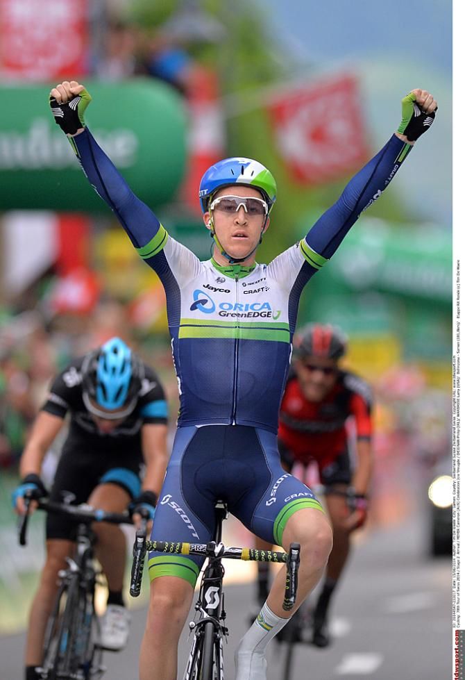 Cameron Meyer (Orica-GreenEdge) crosses the line ahead of fellow breakaway riders Philip Deignan (Team Sky) and Lawrence Warbasse (BMC)