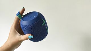 Ultimate Ears Wonderboom 2 review: holding a speaker up with blue nails