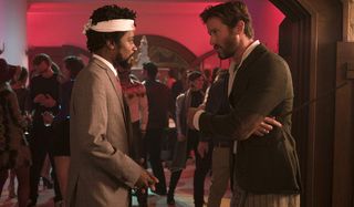 Sorry To Bother You Lakeith Stanfield and Armie Hammer talking at a party