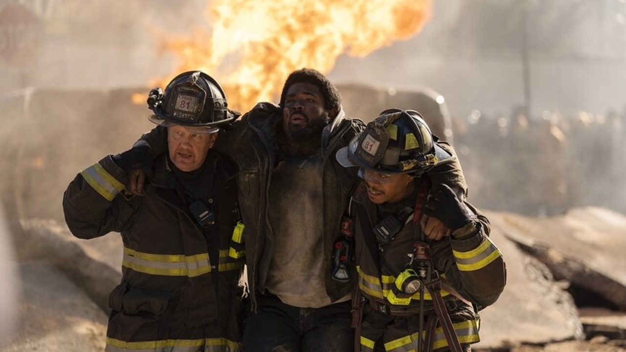Randy 'Mouch' McHolland (Christian Stolte) and Darren Ritter (Daniel Kyri) save an injured man from the flames in "Chicago Fire" Season 13 Episode 11.