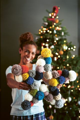 colourful pom pom star wreath and Christmas tree