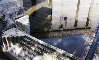 Reflection of the main tomb in the cemetery's pond