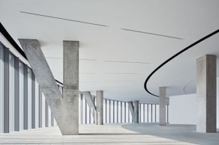 Interior of the He Art Museum. Circular space with concrete structure in the V shape supporting the floor above.