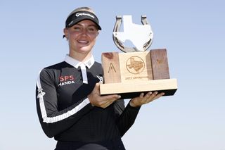 Charley Hull holds the The Ascendant LPGA trophy