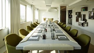 Large elongated business room table and chairs