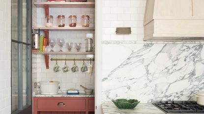 pantry with pink cabinetry and marble splashback