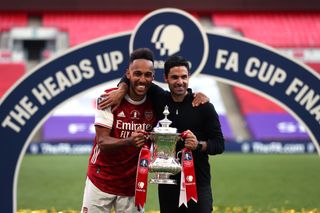 Arsenal’s Pierre-Emerick Aubameyang (left) and manager Mikel Arteta celebrate their FA Cup final victory at Wembley