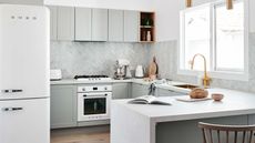 modern, light and bright kitchen with gold tap