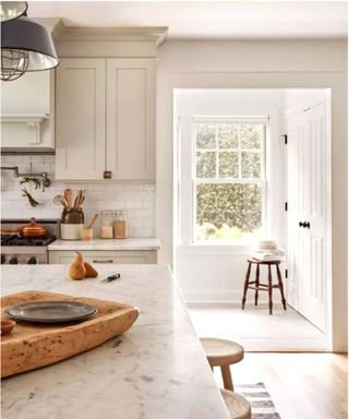 All white kitchen with wooden utensils and jars as decor - Scandinavian design