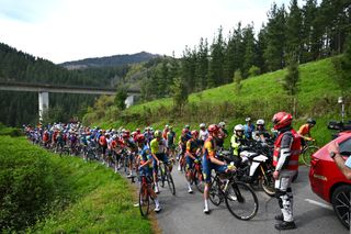 LEGUTIO SPAIN APRIL 04 Tao Geoghegan Hart of The United Kingdom and Team Lidl Trek and a general view of the peloton waiting at Olaeta 582m after the neutralisation of the race due to a multiple crash during the 63rd Itzulia Basque Country 2024 Stage 4 a 1575km stage from Etxarri Aranatz to Legutio 550m Race neutralised due to a multiple riders crash and dropouts The breakaway will dispute the victory UCIWT on April 04 2024 in Etxarri Legutio Spain Photo by Tim de WaeleGetty Images