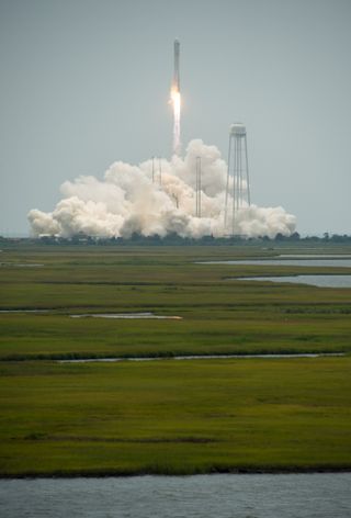 An Orbital Sciences Corporation Antares rocket soars toward space after a successful launch on July 13, 2014 from Pad-0A at NASA's Wallops Flight Facility on Wallops Island, Virginia.