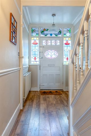 hallway with stained glass door