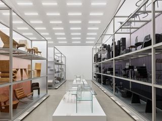 Black and brown furniture on shelves, part of Vitra Design Museum installation
