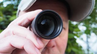 Person looking through a Leica Monovid 8x25 monocular 