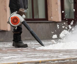 Clearing snow from the pavement