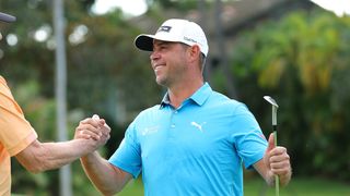 Gary Woodland shakes his coach's hand at the Sony Open in 2024