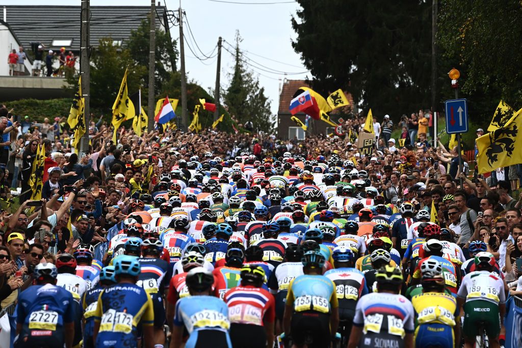 The peloton in the elite men&#039;s road race passes up the cobbled Moskesstraat hill during the 2021 UCI Road World Championships 2021