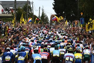 The peloton in the elite men's road race passes up the cobbled Moskesstraat hill during the 2021 UCI Road World Championships 2021