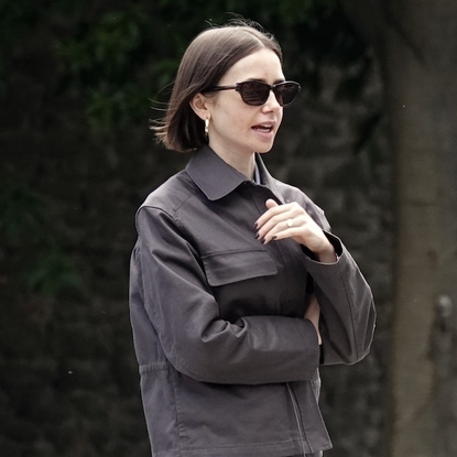American actress Lily Collins takes a break from filming 'Emily in Paris' and enjoys a stroll with her husband Charlie McDowell and pet pooch through Villa Borghese park in Rome. **SHOT ON 05/10/2025**