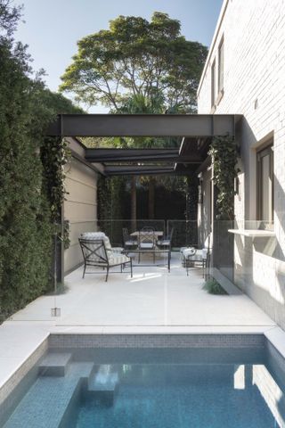 Side yard with seating area and small pool