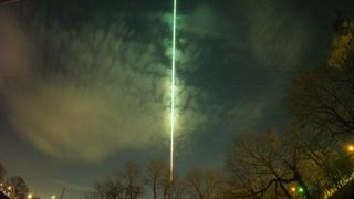 This 30-second exposure of the night sky shows a green fireball streaking toward Lake Ontario near the U.S.-Canada border.