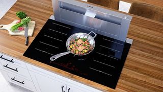 Bosch NITP660UC Benchmark Series 36-inch Built-In Electric Induction Cooktop pictured in kitchen